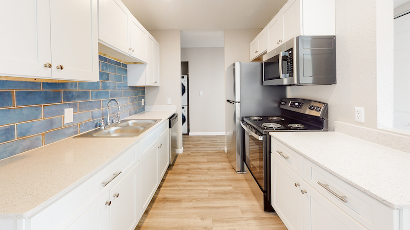 updated kitchen with blue tile backsplash